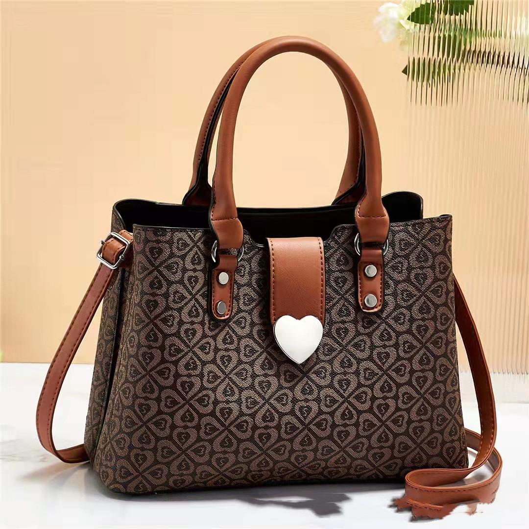 Elegant Heart Clasp Handbag with Pattern