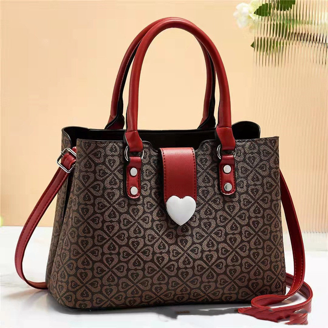 Elegant Heart Clasp Handbag with Pattern